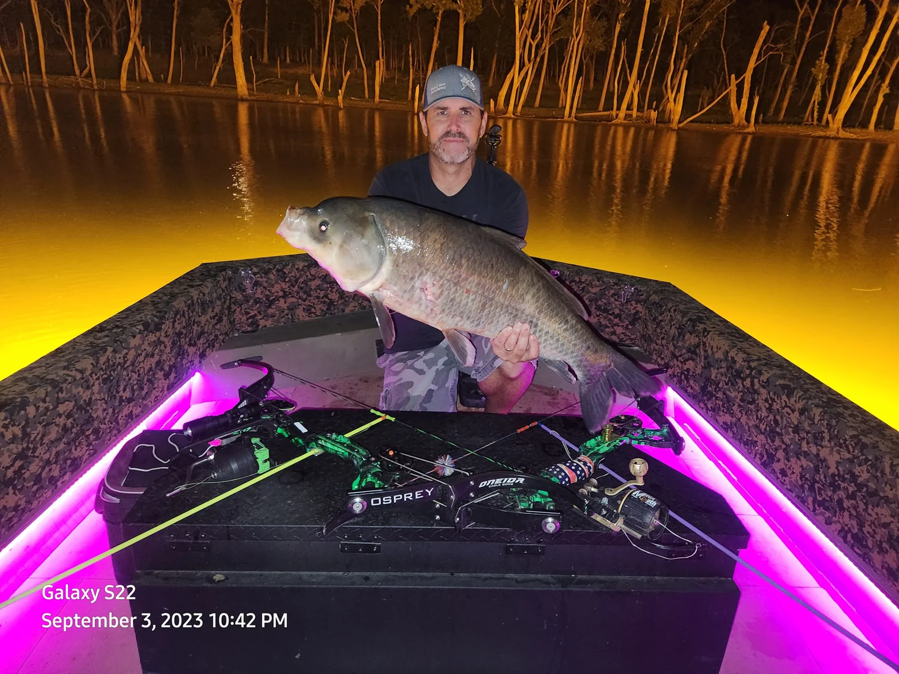 Captain John with a large catch aboard his illuminated Goldline boat